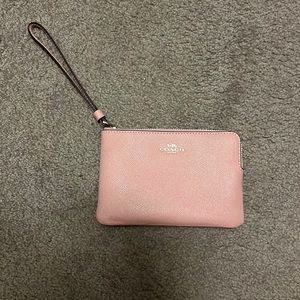 Small light pink Coach wristlet